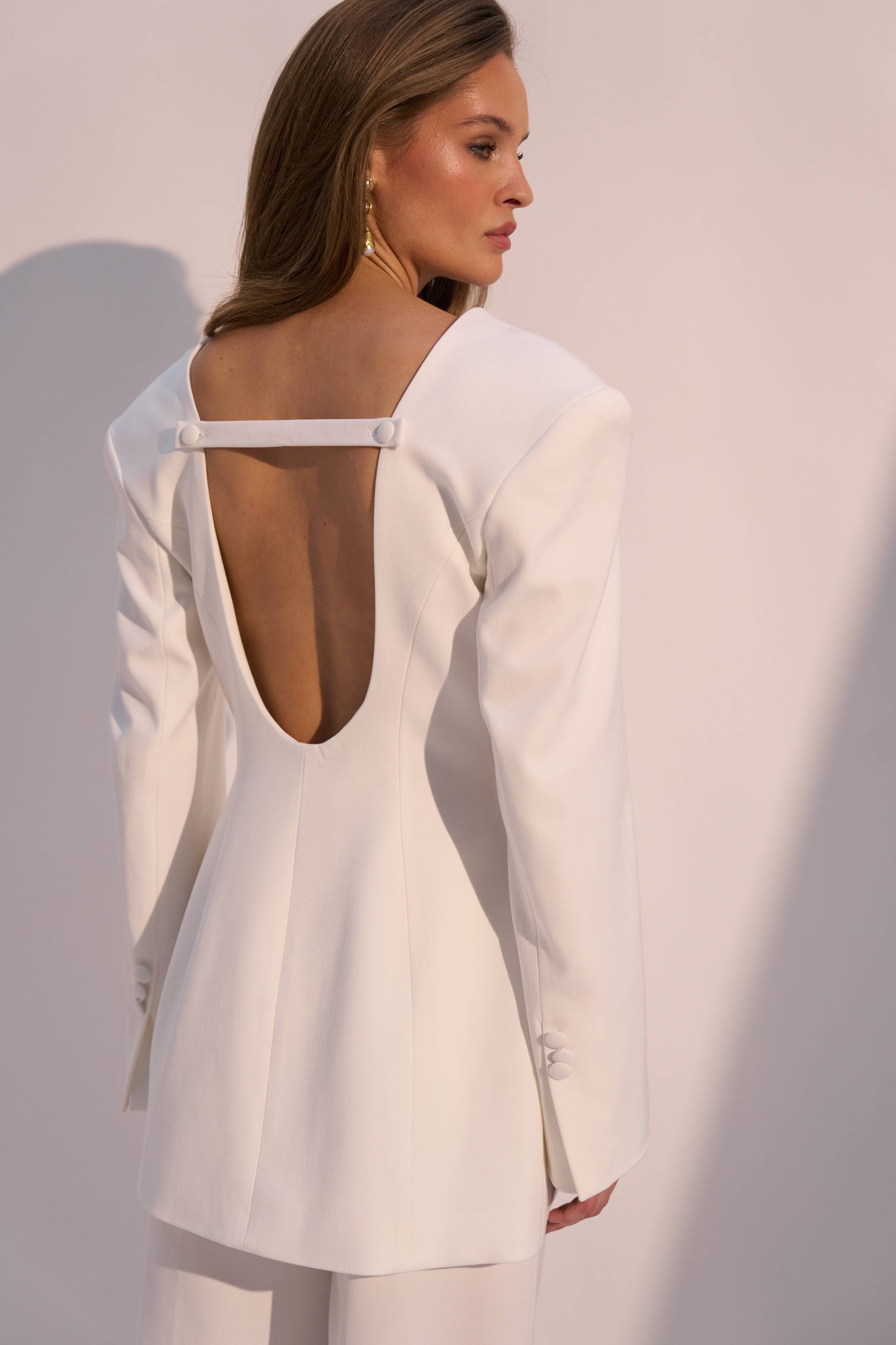 Jacket with a deep V-neck and open back